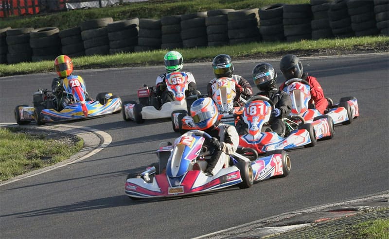 Photo of many people are go karting.